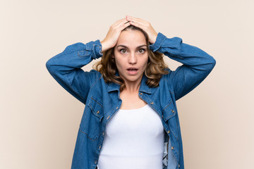 Young blonde woman over isolated background with surprise facial expression