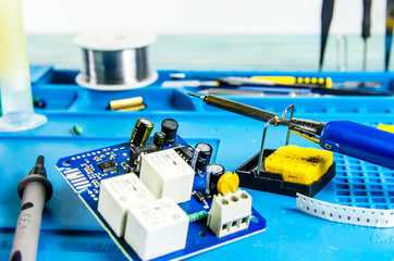 The electrician's workplace. Schemes, soldering iron. Electronics