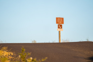 Sign reminds park visitors to pack it in and pack it out, no fireworks and dogs on leashes. Taken in Steptoe Butte State Park Washington USA