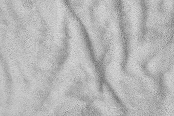 Crumpled seamless texture of a terry towel. Gray color