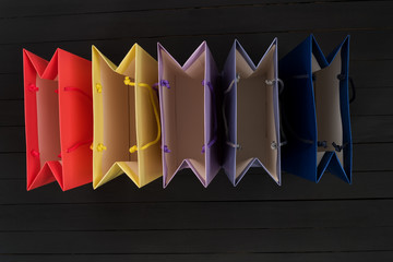 Five empty multi-colored shopping bags. Top view. No shopping