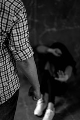 Man beating up his wife illustrating domestic violence, Woman victim of domestic violence and...