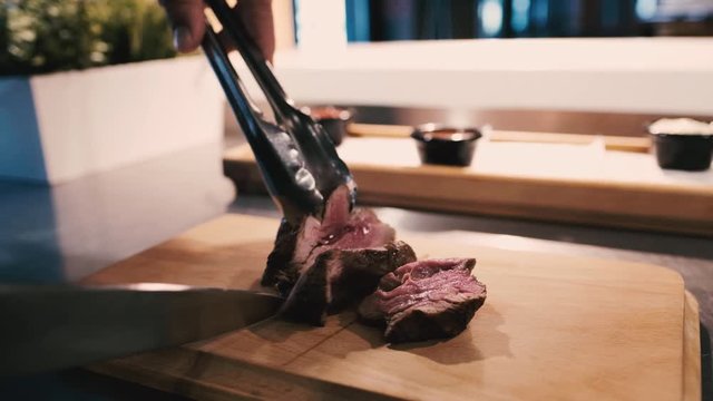 Excerpt from first-class grilled meat, fresh juicy beef tenderloin with slow-motion lines.