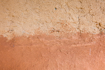 abstract​ texture​ of​ clay​ wall.​ Close-up​ adobe​ wall.