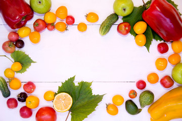Background with vegetables. Vegetables on a white background wood texture top view. Tomatoes cucumbers peppers apples. Proper nutrition and diet. Concept of vegetarianism and detox.