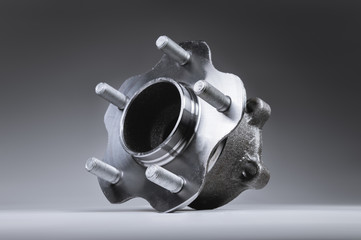 New Wheel hub assembly with bearing. This is part of the car suspension on a gray background with a...