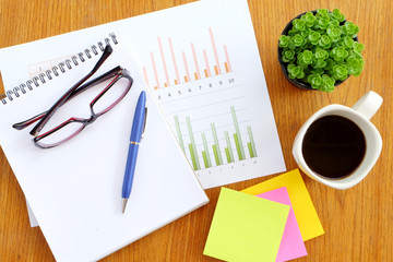 graph paper and note book in business concept