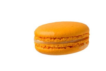 Tender orange macaroons isolated on white background.