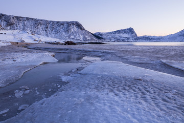 Sunset at Haukland beach on Lofoten islands in winter