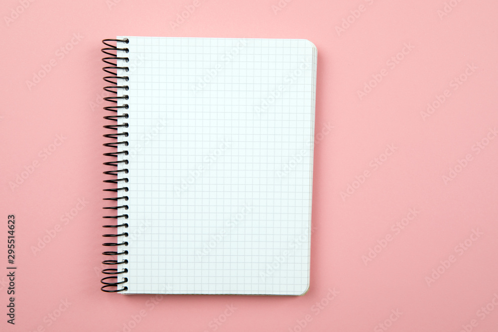 Poster the white open notepad isolated on the pink background
