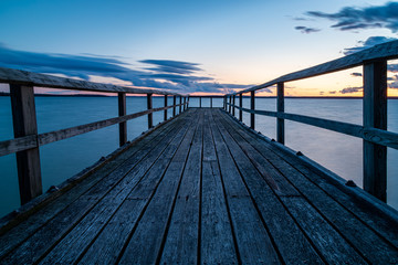 Mullet Lake Low Perspective of Dock at Aloha State Park During Sunset and Blue Hour