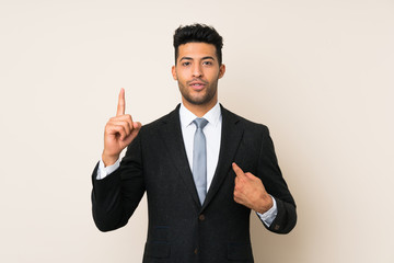 Young handsome businessman man over isolated background with surprise facial expression