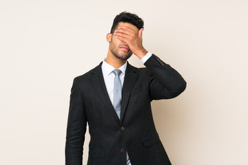 Young handsome businessman man over isolated background covering eyes by hands