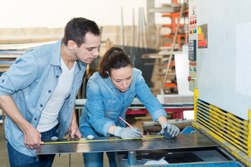 female measuring steel with tape