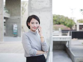 Asian woman with mobile phone