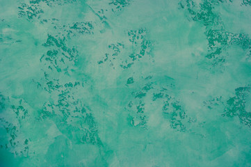 green mint concrete background. old cement concrete. fence construction texture vintage. empty...
