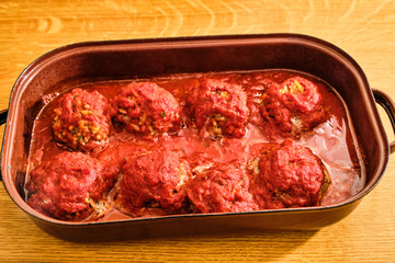 Meat balls with rice with tomato sauce in pan
