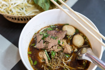 Noodles with Pork Noodles Served with bean sprouts and basil on the table close up thai food