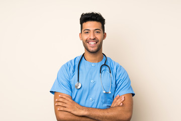 Young handsome man over isolated background with doctor gown