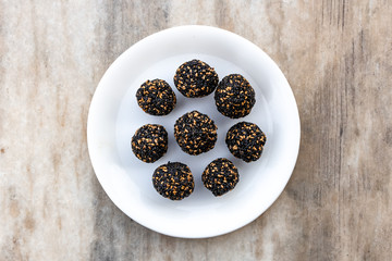 Til ke laddu or Sesame laddu isolated on a white background. Indian sweet