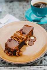 Close-up of sweet chocolate dessert with coffee on a table in a restaurant