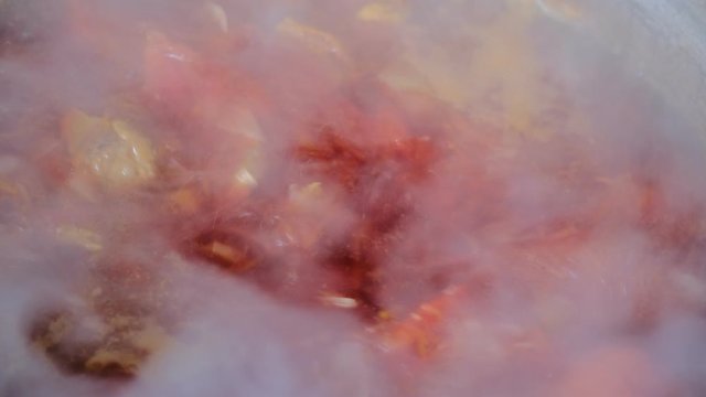 borsch is cooked in a large saucepan. water boils and bubbles. Steam is coming. traditional russian cuisine