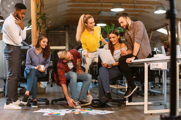 Teamwork. Creative colleagues discussing interior designs with palettes