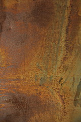 Еexture of rusty iron, cracked paint on an old metallic surface, sheet of rusty metal with cracked and flaky paint, abstract rusty metal texture. Vertical