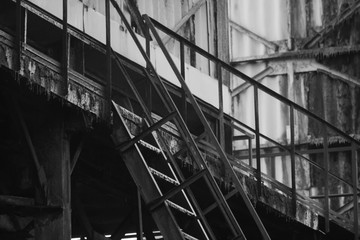 Black and white staircase in an abandoned factory