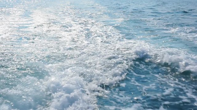 Trace of foamy water on the surface of the ocean due to outboard motor on a boat.1920X1080 Full Hd.