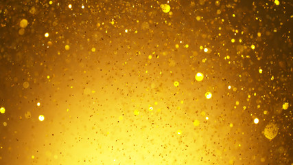 Abstract golden glittering background with blur dots.