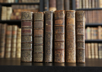 old books on wooden shelf.