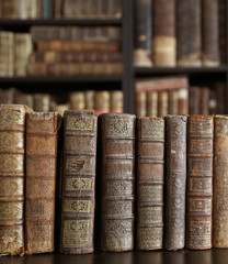 old books on wooden shelf.