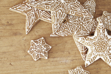 gingerbread stars on wooden background.