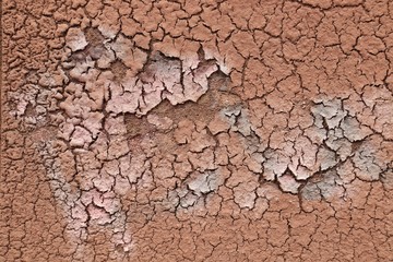 brick-brown putty is cracking and moving away from the surface