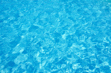 Fototapeta na wymiar pool water with sun reflections
