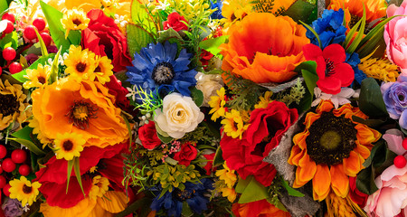 Handmade artificial flowers in a bouquet.