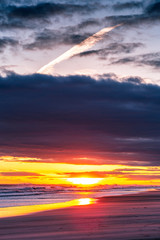 Fototapeta na wymiar Intense Bright Beach Sunset
