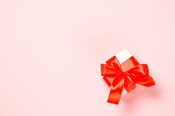 Red present box on pink.