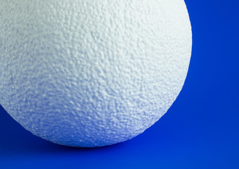 Large white foam ball on bright background