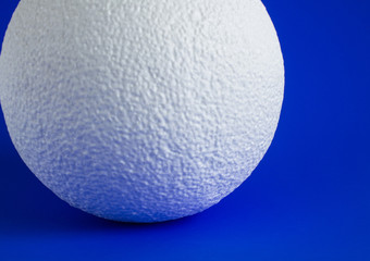 Large white foam ball on bright background