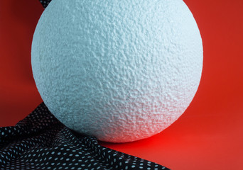 Large white foam ball on bright background
