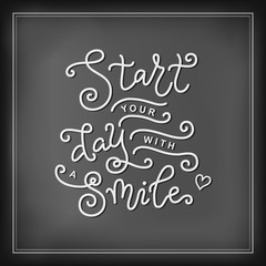 Modern mono line calligraphy lettering of Start your day with a smile in white on chalkboard background with frame