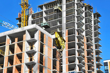 Crane and highrise construction site