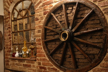 old wooden wheel on the wall
