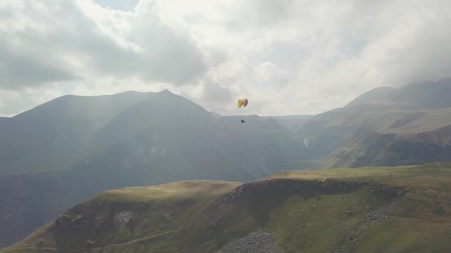 Beautiful Caucasus mountains in Georgia, Gudauri. Paragliding, adrenaline, risky sport