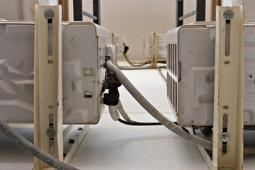 View from below between air conditioning outdoor external units at a hotel in Spain
