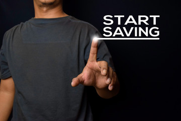 Young man pointed Start Saving text isolated on black background