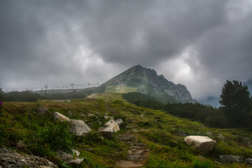 landscape with mountains and clouds and road up