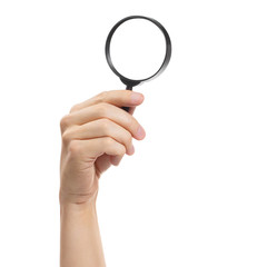 Hand holding a magnifying glass, isolated on white background